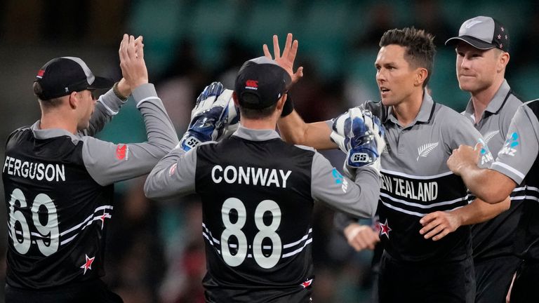 New Zealand's Trent Boult is congratulated by team-mates after bowling Sri Lanka's Dhananjaya de Silva during their T20 World Cup match in Sydney (Associated Press)