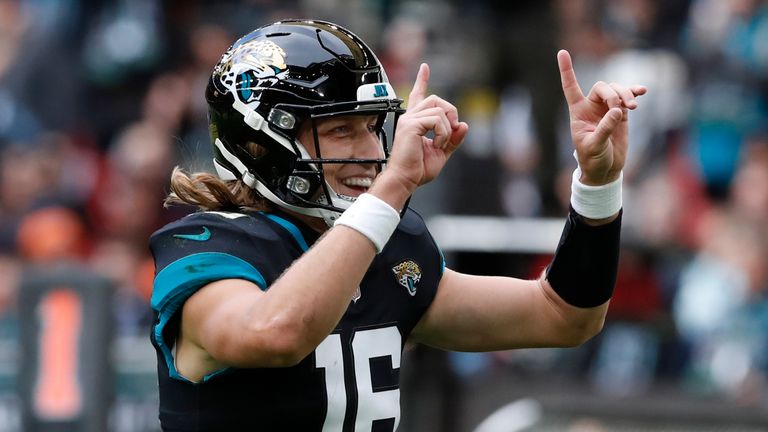Jacksonville Jaguars quarterback Trevor Lawrence (16) celebrates after a touchdown during an NFL football game against the Denver Broncos at Wembley Stadium in London, Sunday, Oct. 30, 2022. (AP Photo/Steve Luciano)