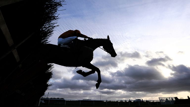 Unanswered Prayers clears a fence at Doncaster