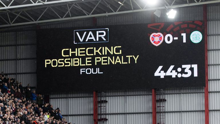 EDINBURGH, SCOTLAND - OCTOBER 22: VAR checks a foul in the box by Celtic&#39;s Cameron Carter-Vickers on Hearts&#39; Cammy Devlin during a cinch Premiership match between Hearts and Celtic at Tynecastle, on October 22, 2022, in Edinburgh, Scotland. (Photo by Craig Williamson / SNS Group)