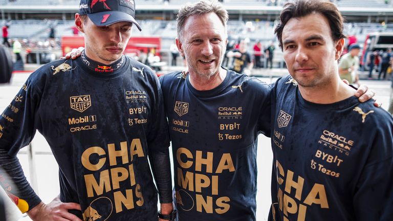  Red Bull drivers Max Verstappen and Sergio Perez (left and right) and team boss Christian Horner
