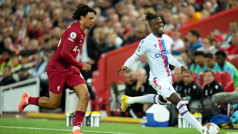 Wilfried Zaha is challenged by Alexander-Arnold