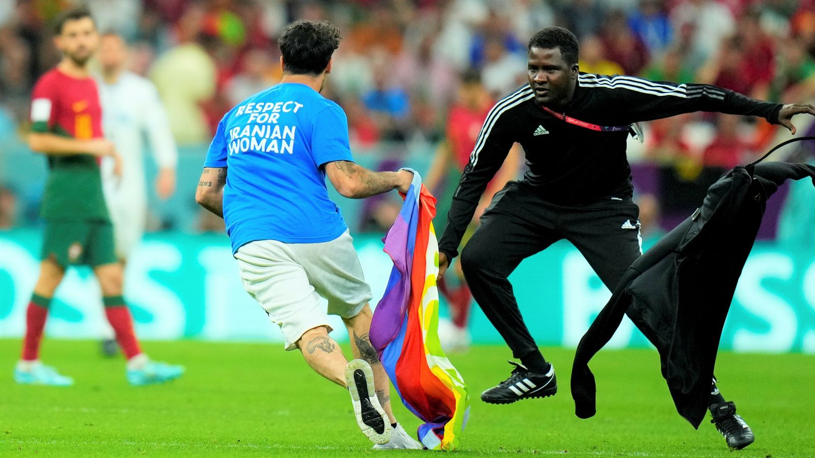 World Cup pitch invader carries rainbow flag onto grass during Portugal vs Uruguay