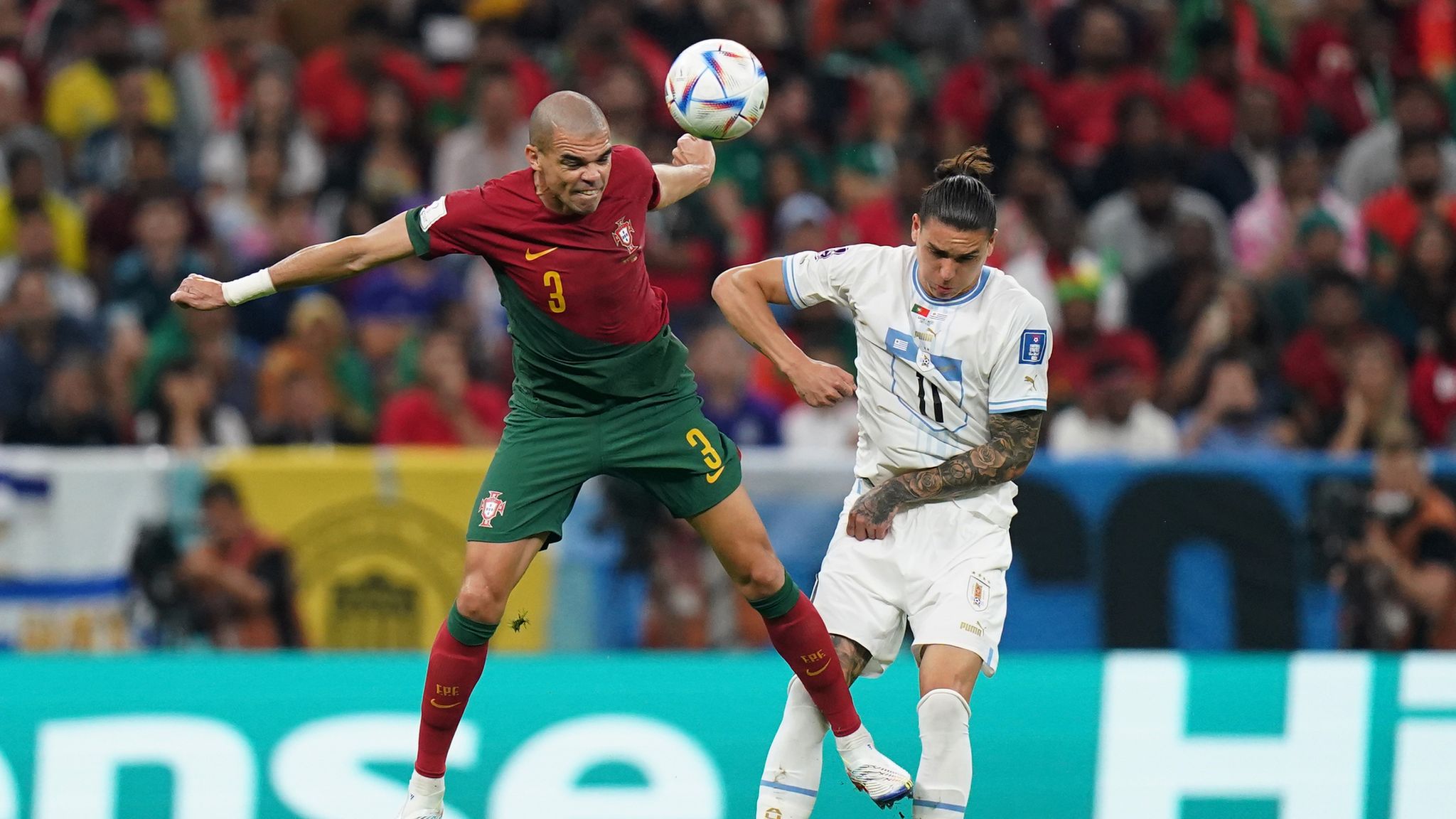 Portugal's Cristiano Ronaldo heads the ball during a team training