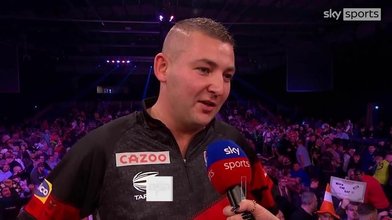 Nathan Aspinall couldn't hide his delight after beating Peter Wright to the top of Group E