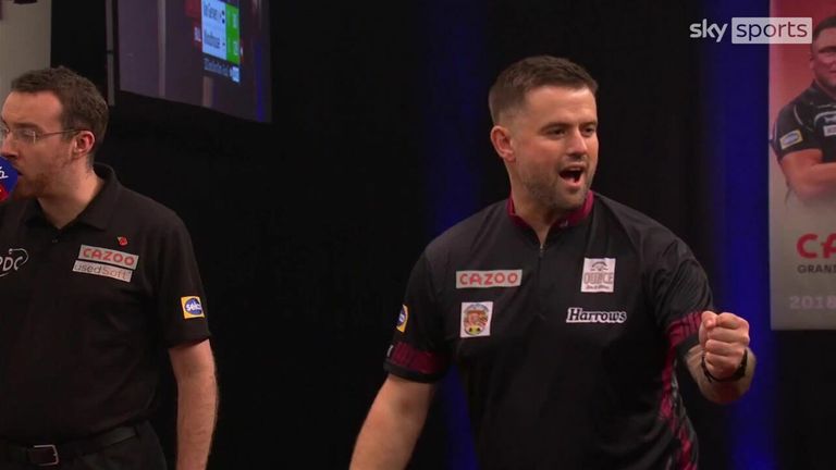 Watch Luke Woodhouse hit a spectacular 129 on the bull against Michael Van Gerwen at the Grand Slam of Darts.