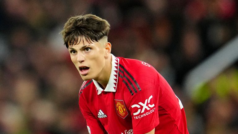 Manchester United's Alejandro Garnacho pulls up his socks during the Europa League group E soccer match between Manchester United and Sheriff at Old Trafford in Manchester, England, Thursday Oct. 27, 2022. (AP Photo/Jon Super)