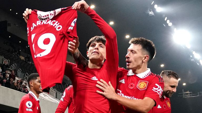 Alejandro Garnacho holds up his shirt after scoring the match-winning goal