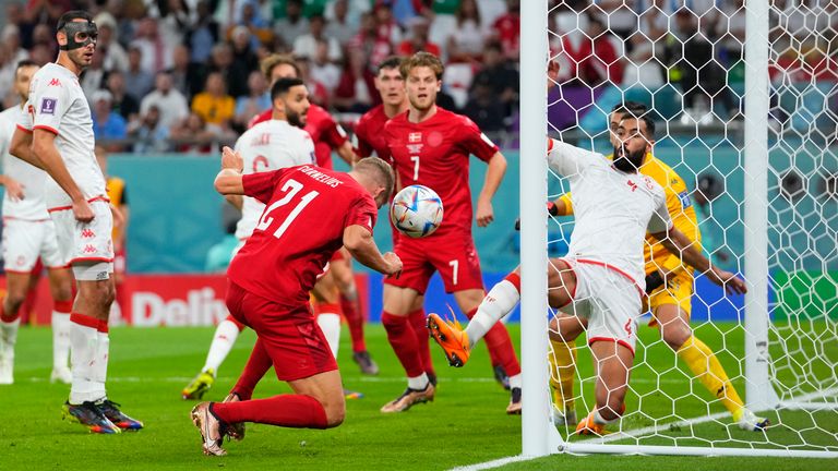 Denmark&#39;s Andreas Cornelius sends his header onto the post