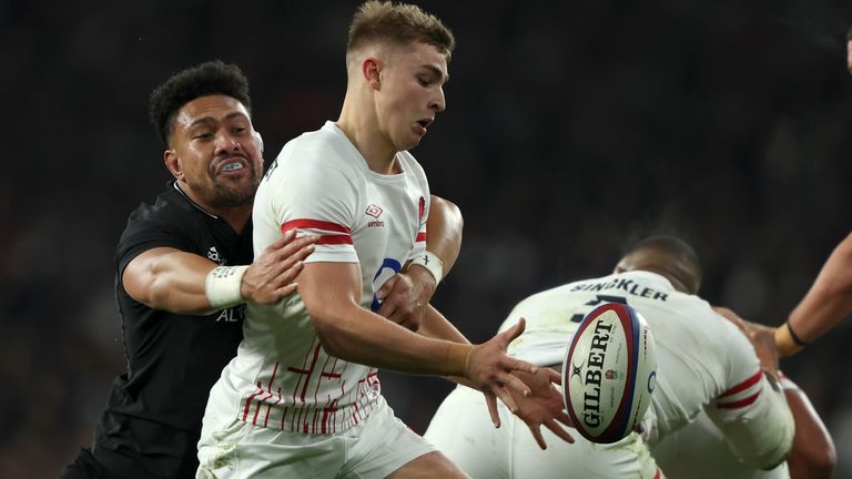 New Zealand's Ardie Savea, left, tackles England's Jack van Poortvliet during the international rugby union match between England and New Zealand at Twickenham stadium in London, Saturday, Nov. 19, 2022. (AP Photo/Ian Walton)