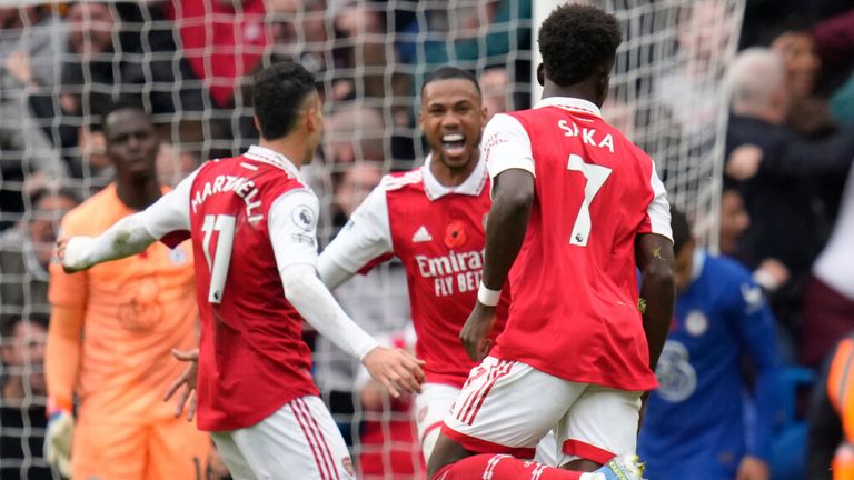 Arsenal players celebrate after going 1-0 up against Chelsea