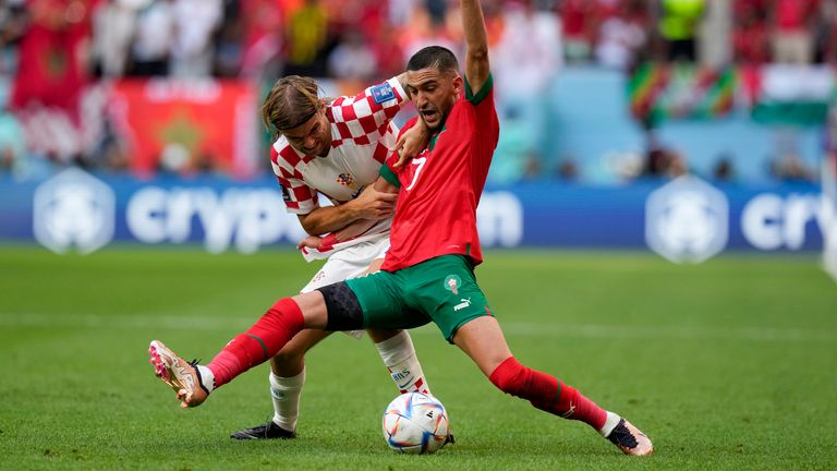 Croatia&#39;s Borna Sosa and Morocco&#39;s Hakim Ziyech compete for the ball