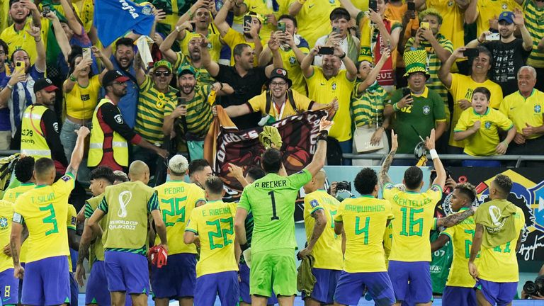 Brazil players celebrate their 1-0 win over Switzerland