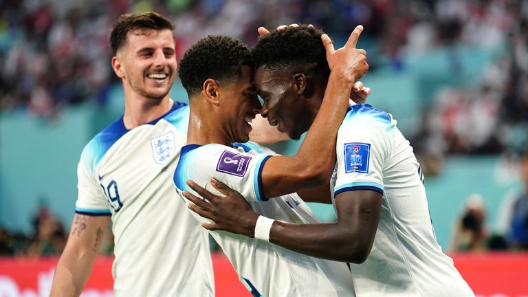 Bukayo Saka celebrates scoring England's second goal with Jude Bellingham