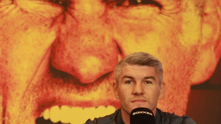 Liam Smith listens to Eubank's comments at their press conference