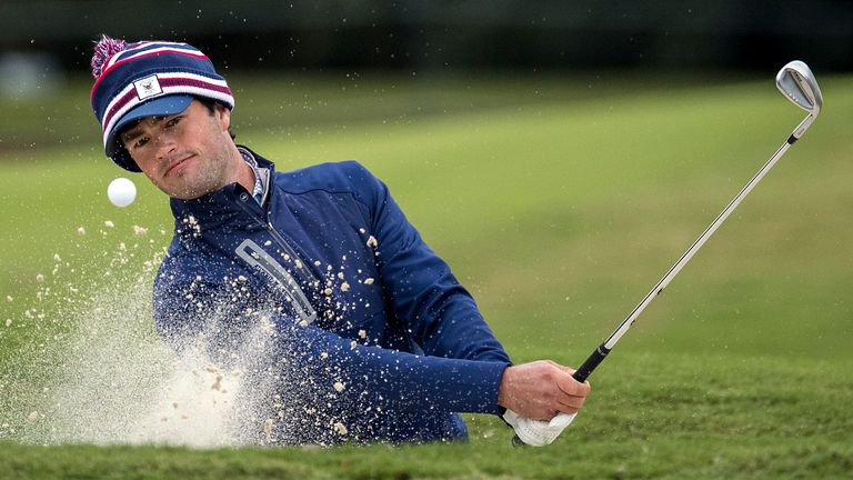 Cole Hammer hits out to a bunker on the ninth green during the first round of the RSM Classic golf tournament, Thursday, Nov. 17, 2022, in St. Simons Island, Ga. (AP Photo/Stephen B. Morton)