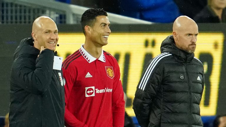 Cristiano Ronaldo stands next to Man United head coach Erik ten Hag waiting to replace Anthony Martial 