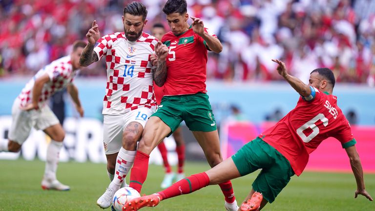 Croatia&#39;s Marko Livaja (left) battles for the ball with Morocco&#39;s Nayef Aguerd and Romain Saiss