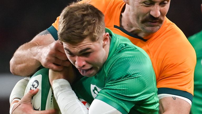 19 November 2022; Jack Crowley of Ireland is tackled by Cadeyrn Neville of Australia during the Bank of Ireland Nations Series match between Ireland and Australia at the Aviva Stadium in Dublin. Photo by Ramsey Cardy/Sportsfile