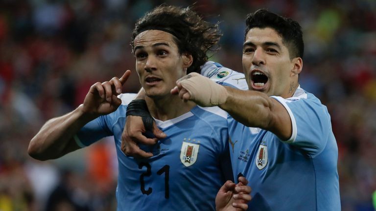 Uruguay's Edinson Cavani, left, celebrates with teammate Luis Suarez after scoring his side's opening goal during a Copa America Group C soccer match against Chile at the Maracana stadium in Rio de Janeiro, Brazil, Monday, June 24, 2019. (AP Photo/Leo Correa)