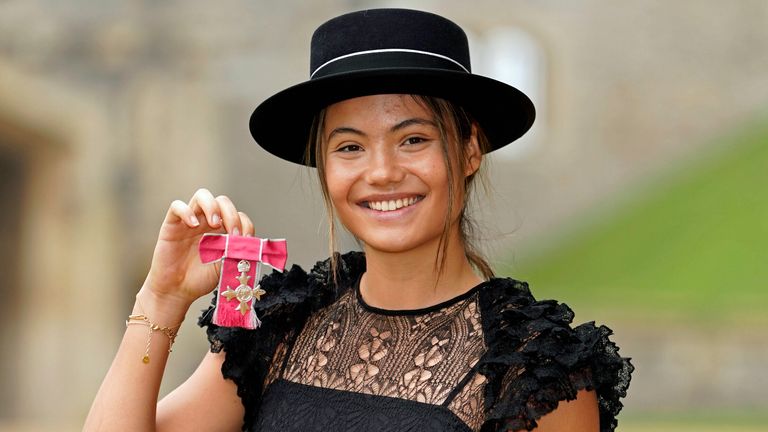Emma Raducanu celebrates being made an MBE (Member of the Order of the British Empire) by King Charles III at Windsor Castle