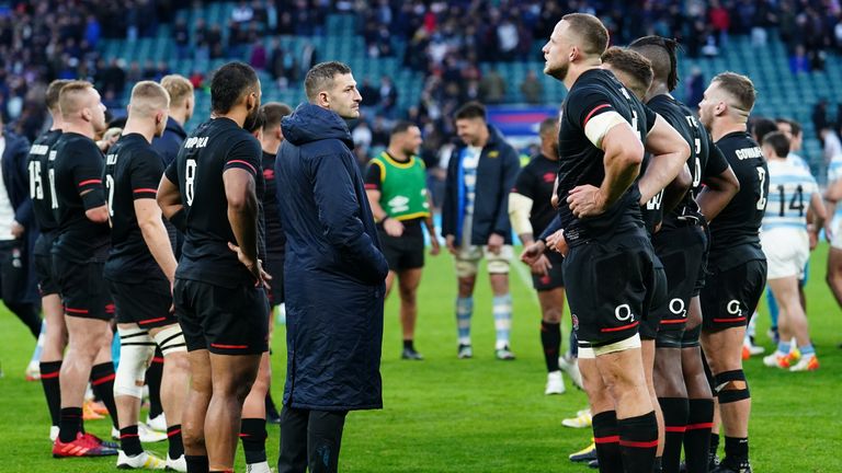 England's players stand dejected after a shock defeat to Argentina at Twickenham