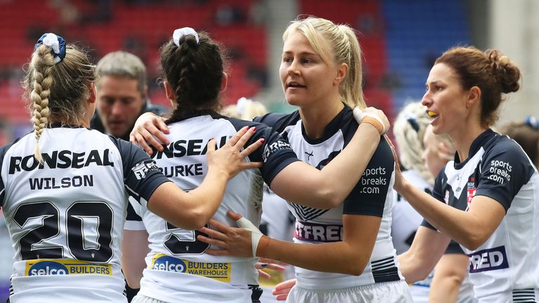 Leah Burke celebrates with team-mate Tara-Jane Stanley after scoring England's opening try against Canada