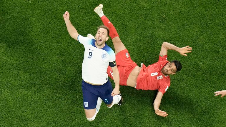 Harry Kane is tackled and injured during England's World Cup match against Iran