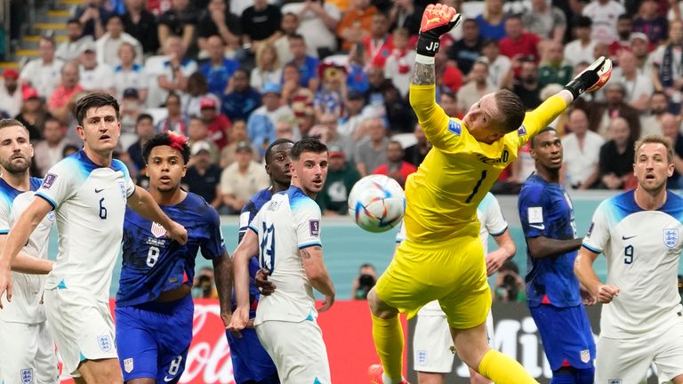 Jordan Pickford watches a USA effort sail wide