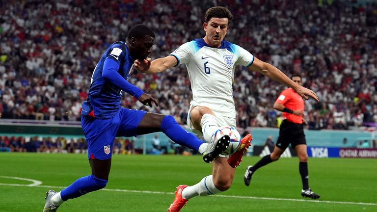 Harry Maguire competes for the ball vs USA