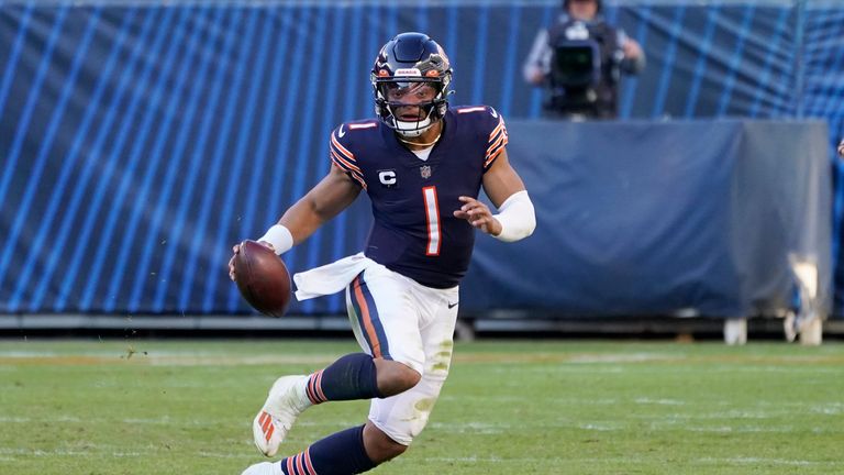 Chicago Bears quarterback Justin Fields runs the ball during the second half of an NFL football game against the Miami Dolphins, Sunday, Nov. 6, 2022 in Chicago. (AP Photo/Charles Rex Arbogast)



