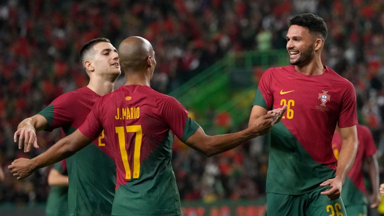 Portugal&#39;s Joao Mario, centre, celebrates after scoring his side&#39;s fourth goal during an international friendly soccer match between Portugal and Nigeria at the Jose Alvalade stadium in Lisbon, Thursday, Nov. 17, 2022. The Portuguese team will leave for Qatar on Friday for the World Cup.