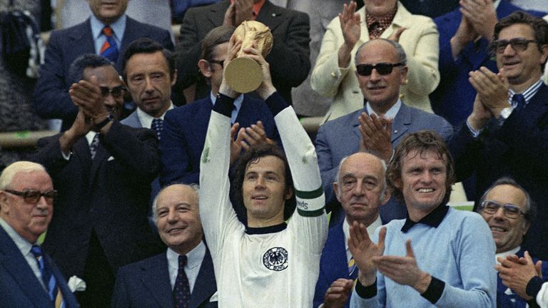 Franz Beckenbauer holds up the World Cup trophy in 1974