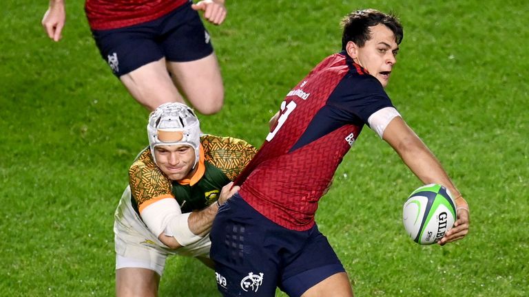 10 November 2022; Antoine Frisch of Munster offloads in the build up to Munster's first try despite the tackle of Henco van Wyk of South Africa Select XV during the match between Munster and South Africa Select XV at P..irc Ui Chaoimh in Cork. Photo by Harry Murphy/Sportsfile