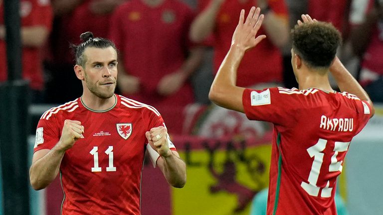 Wales&#39; Gareth Bale celebrates with Ethan Ampadu, right, after scoring vs United States