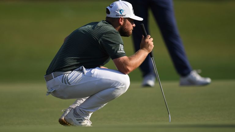 Tyrrell Hatton of England checks the 18th green during DP World Tour Championship in Dubai, United Arab Emirates, Thursday, Nov. 17, 2022. (AP Photo/Martin Dokoupil)