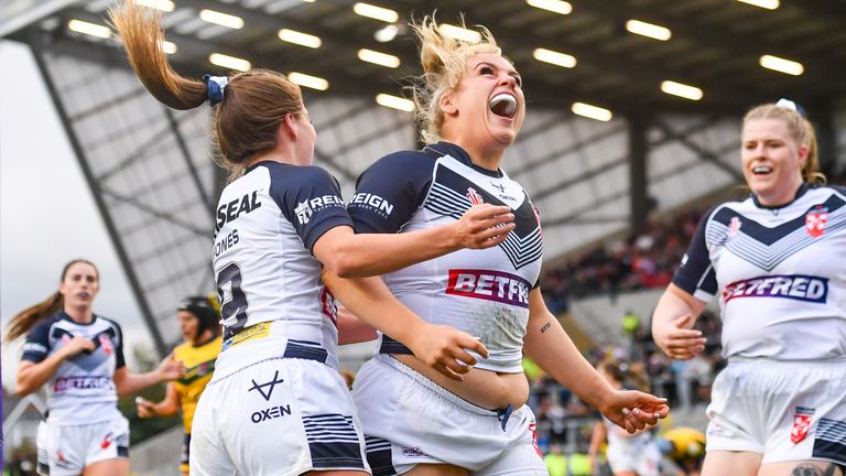 Grace Field celebrates scoring a try in England's win over Brazil