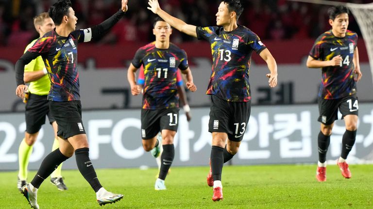 South Korea's Son Heung-min, left, celebrates with his teammate Son Jun-ho after scoring a goal during a friendly soccer match against Costa Rica in Goyang, South Korea, Friday, Sept. 23, 2022. (AP Photo/Ahn Young-joon)