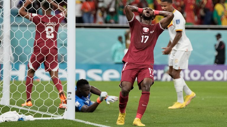 Qatar&#39;s Ismail Mohamad reacts after his shot is saved by Senegal&#39;s Edouard Mendy