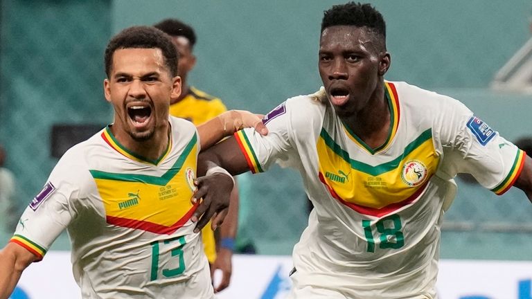 Senegal's Ismaila Sarr celebrates with team-mates after scoring a penalty