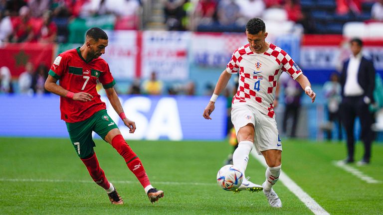 Croatia&#39;s Ivan Perisic vies for the ball with Morocco&#39;s Hakim Ziyech