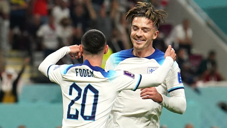 Jack Grealish is congratulated by Phil Foden after scoring England&#39;s sixth goal