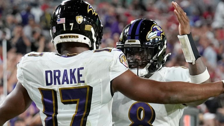 Baltimore Ravens running back Kenyan Drake (17) is congratulated by quarterback Lamar Jackson (8) after scoring during the second half of an NFL football game against the Tampa Bay Buccaneers Thursday, Oct. 27, 2022, in Tampa, Fla. (AP Photo/Chris O'Meara)