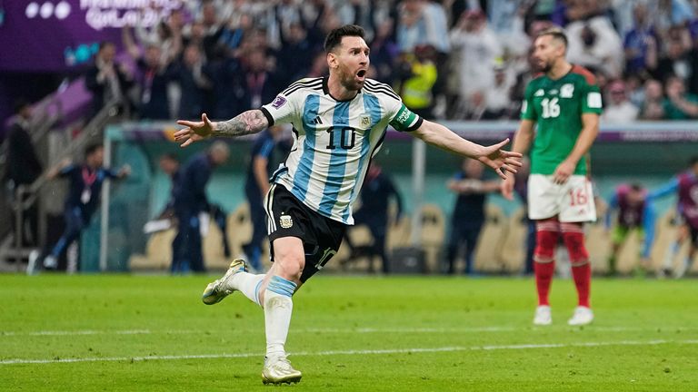 Lionel Messi sprints towards Argentina supporters to celebrate