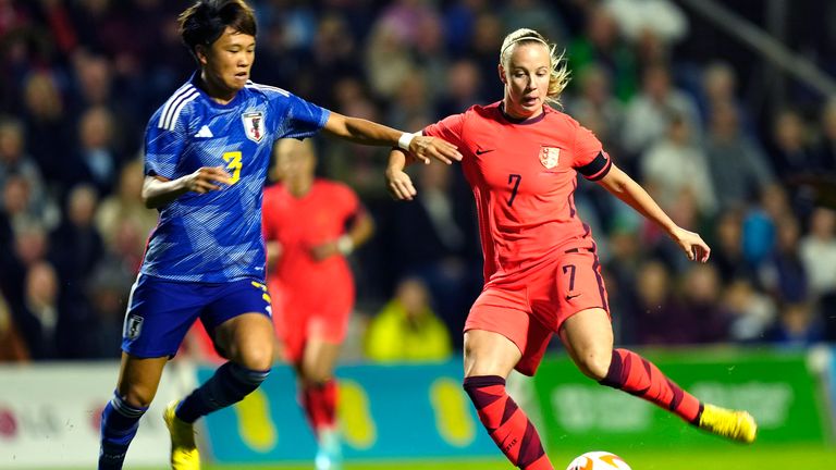 Japan's Moeka Minami challenges for the ball with England's Beth Mead