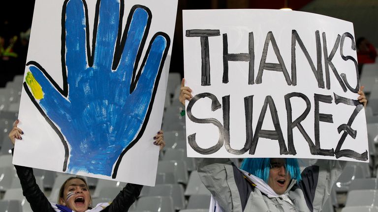 Uruguay fans celebrate Suarez&#39;s intervention