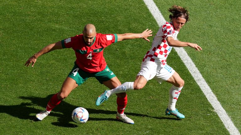 Croatia's Luka Modric (right) and Morocco's Sofyan Amrabat battle for the ball 