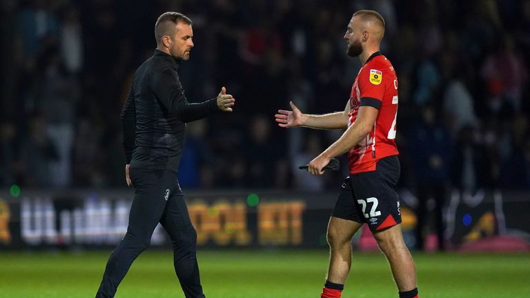 Luton Town manager Nathan Jones shakes hands with Allan Campbell after the Sky Bet Championship match at Kenilworth Road, Luton. Picture date: Friday August 26, 2022.