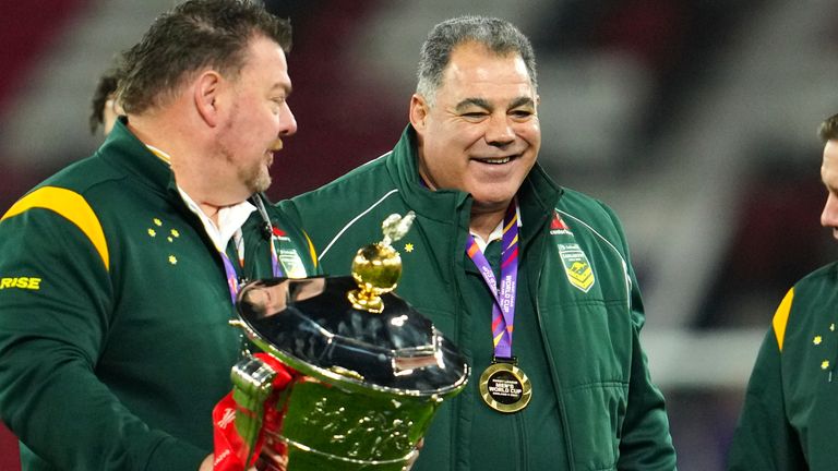 Australia's head coach Mal Meninga, centre, after the Rugby League World Cup final match between Australia and Samoa at the Old Trafford Stadium in Manchester, England, Saturday, Nov. 19, 2022. (AP Photo/Jon Super)