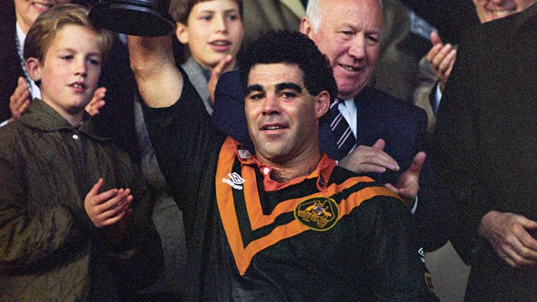 THE AUSTRALIAN CAPTAIN, MAL MENINGA,.HOLDS THE RUGBY LEAGUE WORLD CUP ALOFT.AFTER HIS TEAM DEFEATED GREAT BRITAIN.10-6 AT WEMBLEY.  